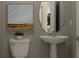 Charming bathroom featuring pedestal sink and decorative art at 9320 Bonita Mar Dr, Parrish, FL 34219