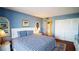 Serene bedroom with closet and in-unit washer and dryer access, complete with stylish decor at 100 Oakmont Ln # 605, Belleair, FL 33756