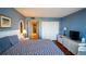 Cozy bedroom with hardwood floors and a closet, featuring a beach-themed decor at 100 Oakmont Ln # 605, Belleair, FL 33756