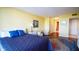 Airy bedroom with view of hallway, complete with hardwood floors and a spacious closet at 100 Oakmont Ln # 605, Belleair, FL 33756