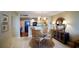 Cozy dining area features a glass table, stylish seating, and adjacent access to the kitchen area at 100 Oakmont Ln # 605, Belleair, FL 33756