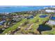 Overhead view of the golf course with water features winding through the well-maintained greens at 100 Oakmont Ln # 605, Belleair, FL 33756