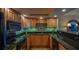Well-equipped kitchen featuring stainless steel appliances, granite countertops, and ample cabinetry at 100 Oakmont Ln # 605, Belleair, FL 33756