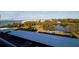 View from above showing the parking lot next to a lake and condos in the distance at 100 Oakmont Ln # 605, Belleair, FL 33756