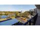Scenic view overlooking lush landscaping, lake, and neighboring buildings from balcony at 100 Oakmont Ln # 605, Belleair, FL 33756