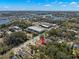 Aerial view of property with close proximity to the waterfront, highlighted by red arrow at 104 Anclote Rd # 104, Tarpon Springs, FL 34689