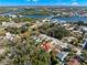 Beautiful aerial view of property close to waterfront, highlighted by red arrow at 104 Anclote Rd # 104, Tarpon Springs, FL 34689