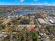 Aerial view of property with scenic river view, highlighted by red arrow at 104 Anclote Rd # 104, Tarpon Springs, FL 34689