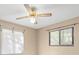 Bedroom featuring a ceiling fan and two windows at 104 Anclote Rd # 104, Tarpon Springs, FL 34689