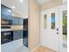 Bright kitchen entrance featuring modern appliances, sleek cabinets, and a contemporary design at 104 Anclote Rd # 104, Tarpon Springs, FL 34689