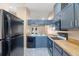 Modern kitchen boasts sleek appliances and ample counter space, perfect for culinary creations at 104 Anclote Rd # 104, Tarpon Springs, FL 34689