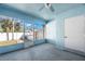 Enclosed and covered sunroom with concrete flooring at 104 Anclote Rd # 104, Tarpon Springs, FL 34689