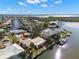 A scenic aerial view showcases the canal-front homes in a waterfront neighborhood with canal access at 10427 Spoonbill W Rd, Bradenton, FL 34209