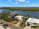 Stunning aerial view of waterfront homes, featuring lush landscapes and serene water views at 10427 Spoonbill W Rd, Bradenton, FL 34209