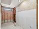 A bathroom under construction revealing insulation and updated plumbing at 10427 Spoonbill W Rd, Bradenton, FL 34209
