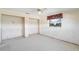Bedroom featuring two closets and a window with a view of the water at 10427 Spoonbill W Rd, Bradenton, FL 34209