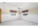 Bedroom with two windows allowing natural light to illuminate the space at 10427 Spoonbill W Rd, Bradenton, FL 34209