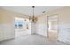 Open dining room area featuring a chandelier and easy access to adjacent living spaces at 10427 Spoonbill W Rd, Bradenton, FL 34209