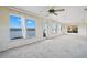 Bright living room with multiple windows showcasing stunning water views at 10427 Spoonbill W Rd, Bradenton, FL 34209