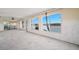 Spacious living room featuring large windows with views of the water at 10427 Spoonbill W Rd, Bradenton, FL 34209