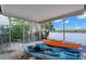 Screened porch with kayaks and a view of the water at 10427 Spoonbill W Rd, Bradenton, FL 34209