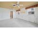Large room featuring bright sun with multiple windows, ceiling fans and ample space for activities at 10427 Spoonbill W Rd, Bradenton, FL 34209