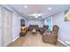 Relaxing living room features a ceiling fan and rich brown furnishings at 1111 Durant Rd, Brandon, FL 33511