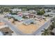 Aerial view of a well-kept single-Gathering home in a quiet residential neighborhood with mature trees at 1118 Excalibur St, Holiday, FL 34690