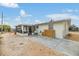 Backyard view of the home featuring a screened-in porch, exterior access and yard at 1118 Excalibur St, Holiday, FL 34690