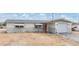 Classic home featuring a red front door, one car garage, and minimalist landscaping at 1118 Excalibur St, Holiday, FL 34690