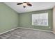 Bedroom with carpet, neutral walls, and a large window at 11266 Kapok Grand Cir, Madeira Beach, FL 33708