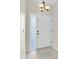 Entryway with frosted window next to the door at 11266 Kapok Grand Cir, Madeira Beach, FL 33708