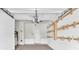 Garage with custom wall-mounted storage at 11266 Kapok Grand Cir, Madeira Beach, FL 33708