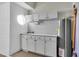 Garage with a sink and a storage closet at 11266 Kapok Grand Cir, Madeira Beach, FL 33708