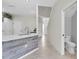 Hallway connecting the kitchen and a half bathroom at 11266 Kapok Grand Cir, Madeira Beach, FL 33708
