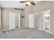 Spacious carpeted main bedroom with ensuite bathroom and walk-in closet at 11266 Kapok Grand Cir, Madeira Beach, FL 33708