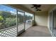 Outdoor patio with white lattice fence and green landscape view at 11266 Kapok Grand Cir, Madeira Beach, FL 33708