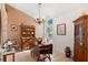 Charming dining room featuring a chandelier, decorative furniture, and a window with a view of the outdoors at 11508 Smokethorn Dr, Riverview, FL 33579