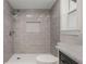 Shower with sleek gray tile, mosaic tile, and a rainfall shower head at 1177 86Th N Ter, St Petersburg, FL 33702