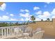 Enjoy breathtaking ocean views from this delightful balcony featuring cozy wicker furniture at 1200 N Shore Ne Dr # 102, St Petersburg, FL 33701