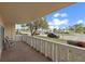 This balcony features tile flooring, seating, and views of the community at 1200 N Shore Ne Dr # 102, St Petersburg, FL 33701