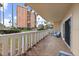 This balcony features tile flooring, seating, and views of the community at 1200 N Shore Ne Dr # 102, St Petersburg, FL 33701