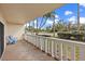 This balcony features tile flooring, seating, and views of the community at 1200 N Shore Ne Dr # 102, St Petersburg, FL 33701