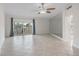Spacious living room featuring tile floors and sliding glass doors to an outdoor balcony at 1200 N Shore Ne Dr # 102, St Petersburg, FL 33701