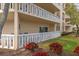 Ground-floor patio area with a garden view and sliding door entry to the home at 1200 N Shore Ne Dr # 102, St Petersburg, FL 33701