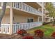 Ground floor patio with garden view and white railing at 1200 N Shore Ne Dr # 102, St Petersburg, FL 33701
