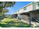 Backyard featuring a screened patio with a view of a pond, offering a relaxing outdoor living space at 12709 Raeburn Way, Tampa, FL 33624