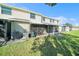 Inviting screened-in patio in a backyard with a view, perfect for enjoying outdoor living and relaxation at 12709 Raeburn Way, Tampa, FL 33624