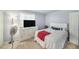 Cozy bedroom featuring white furniture, bright walls, and natural light at 12709 Raeburn Way, Tampa, FL 33624