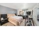 Bedroom featuring neutral walls, exercise equipment, and double closets at 12709 Raeburn Way, Tampa, FL 33624